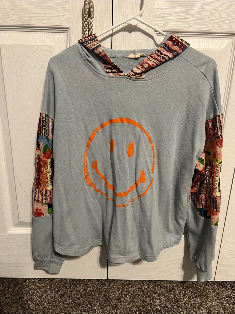Light Blue Smiley Hoodie Sweater with Patterned Sleeve Insets